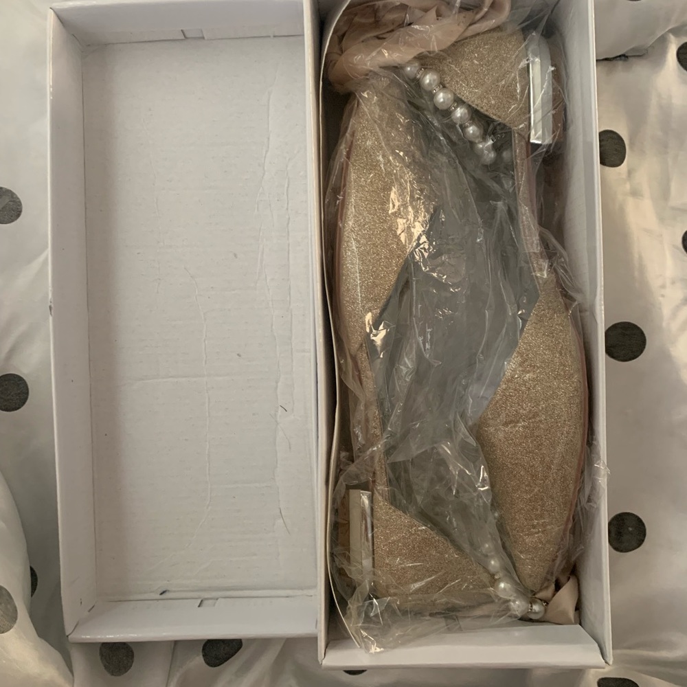 Gold glitter ballet flats.